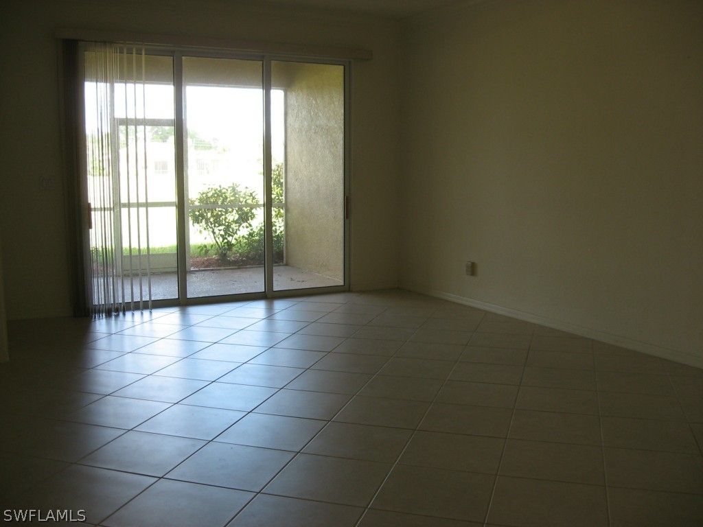 4676 Fairloop Run Lehigh Acres, FL 33973 - Photo 7 of 21 a view of an empty room with a window