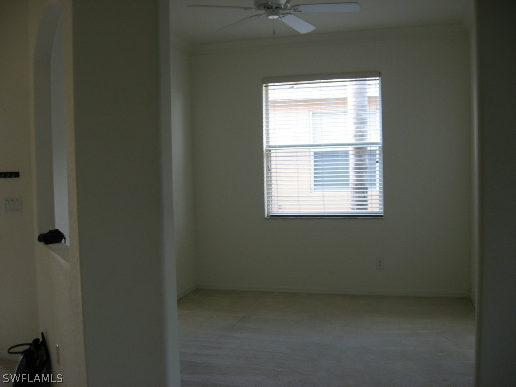 4676 Fairloop Run Lehigh Acres, FL 33973 - Photo 8 of 21 a view of an empty room with a window