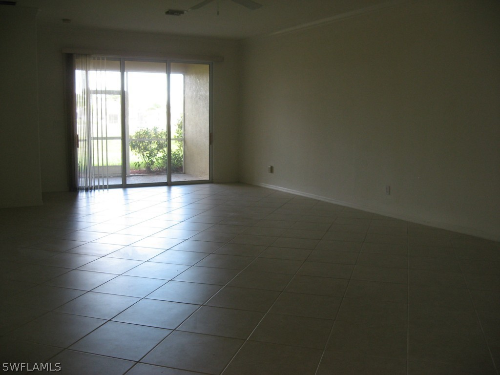 4676 Fairloop Run Lehigh Acres, FL 33973 - Photo 9 of 21 a view of a livingroom and window