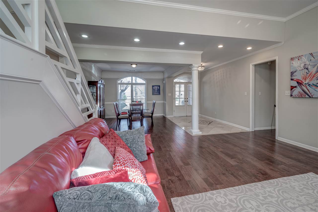 10388 Pilot Rock Road Collierville, TN 38017 - Photo 2 of 24 View from Great Room to Formal Entry and Dining Room. Entry features 9 ft. ceiling with crown molding, custom tile floor and 8 ft. double door with transom window.