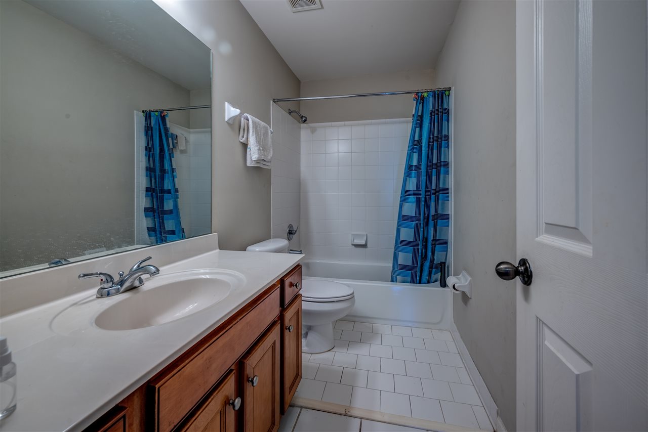 10388 Pilot Rock Road Collierville, TN 38017 - Photo 19 of 24 Features tile floor, 4.5' vanity with 2 drawers and tile shower walls at steel tub.