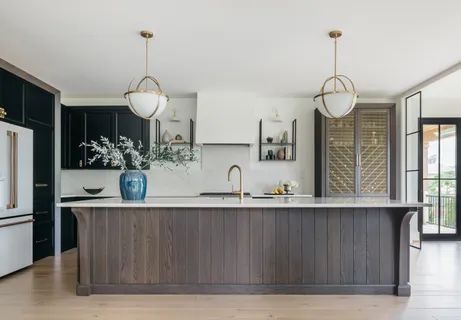 a view of a kitchen with cabinets and stainless steel appliances