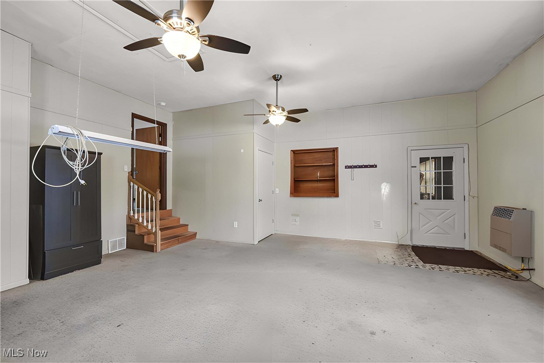 7190 Middle Ridge Road Madison, OH 44057 - Photo 19 of 19 Family room with heating unit and ceiling fan