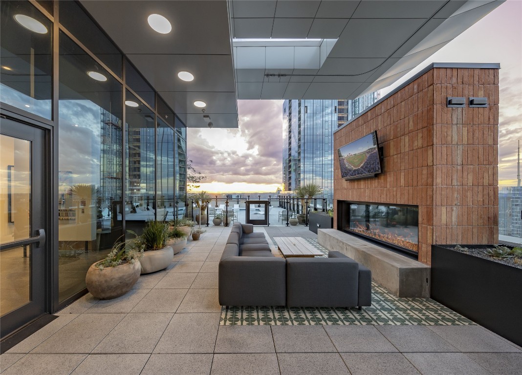 84 East Avenue, Unit 1506 Austin, TX 78701 - Photo 27 of 36 Cozy up by the rooftop fireplace.