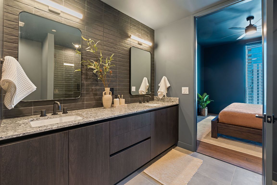 84 East Avenue, Unit 1506 Austin, TX 78701 - Photo 5 of 36 Representative Photo. Primary bathroom with oversized floor tiles, a walk in shower, custom fixtures, and other luxurious features.