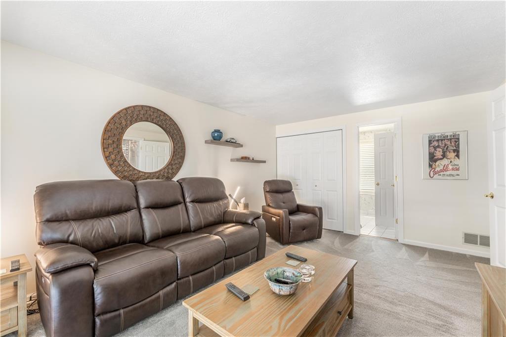 79 Fawnvue Drive McKees Rocks, PA 15136 - Photo 18 of 33 a living room with furniture a rug and a window