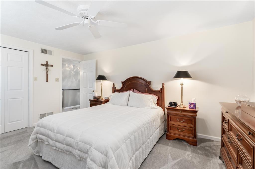 79 Fawnvue Drive McKees Rocks, PA 15136 - Photo 21 of 33 a bedroom with a bed and a chandelier