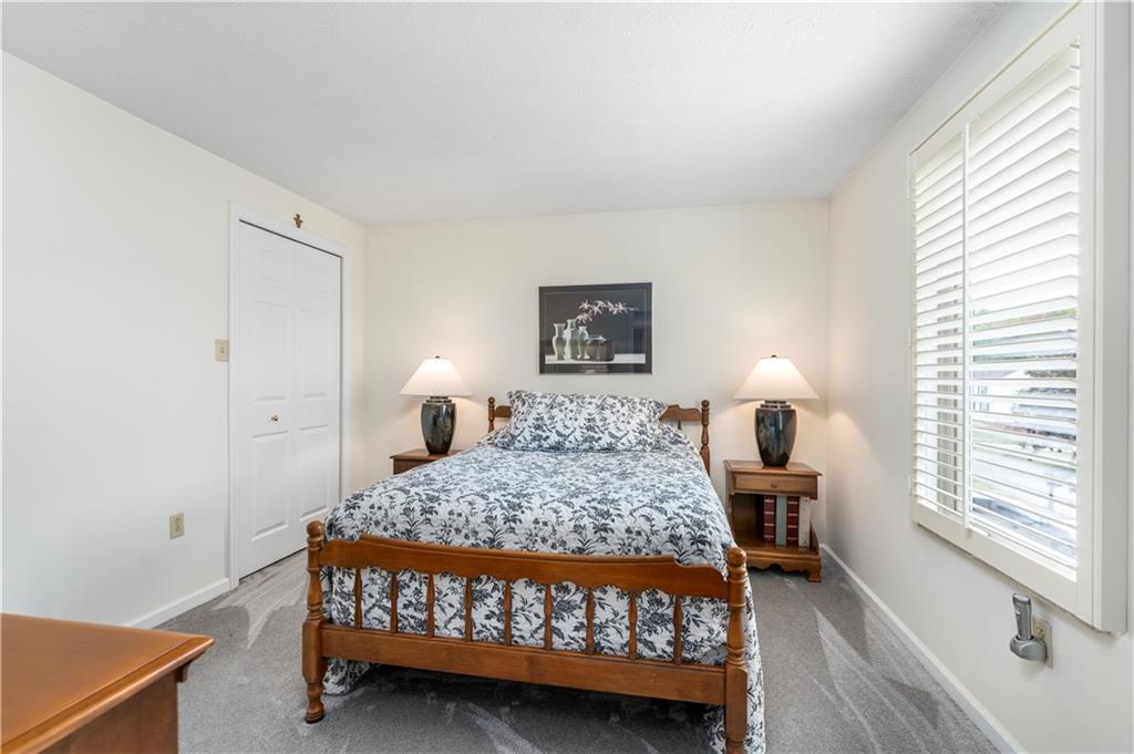 79 Fawnvue Drive McKees Rocks, PA 15136 - Photo 26 of 33 a bedroom with a bed and a lamp with window