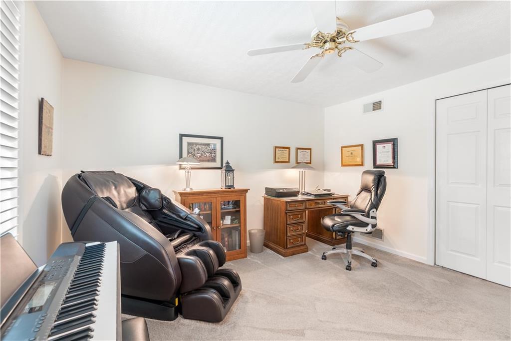 79 Fawnvue Drive McKees Rocks, PA 15136 - Photo 27 of 33 a view of a workspace with furniture and a ceiling fan