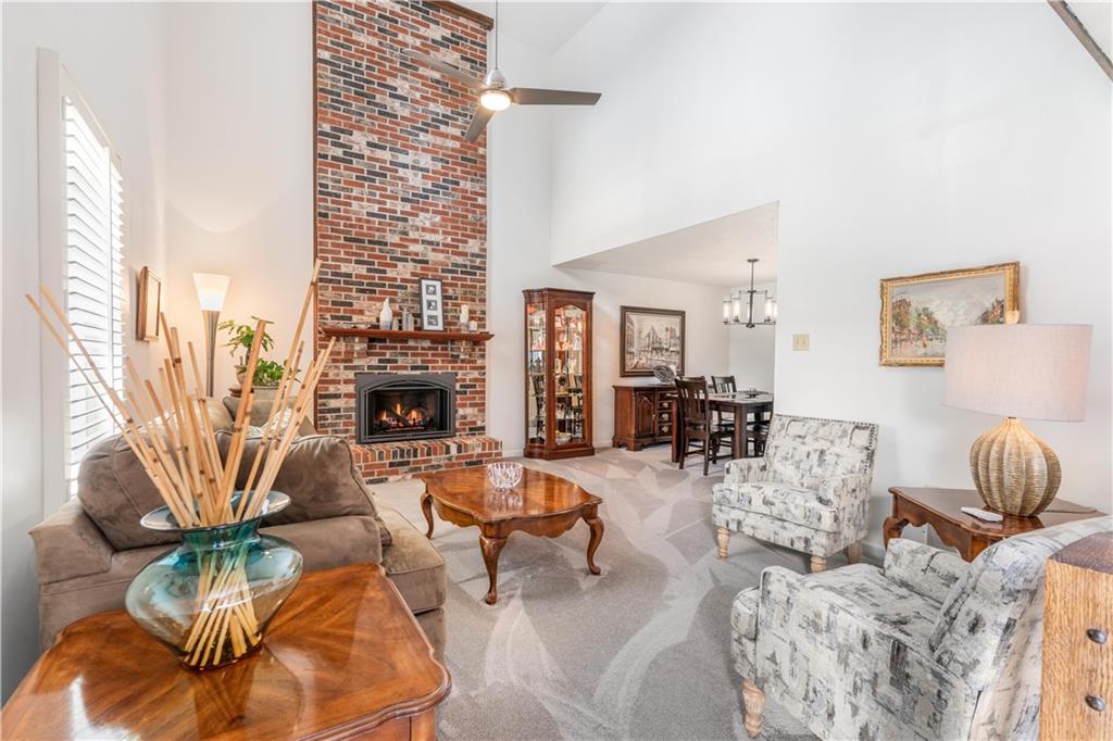 79 Fawnvue Drive McKees Rocks, PA 15136 - Photo 6 of 33 a living room with furniture a fireplace and a large window