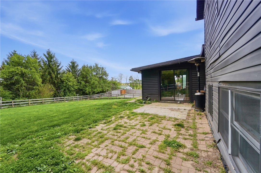 5209 North Addison New Carlisle Road St. Paris, OH 43072 - Photo 42 of 47 This spacious backyard with a patio offers a private outdoor retreat.
