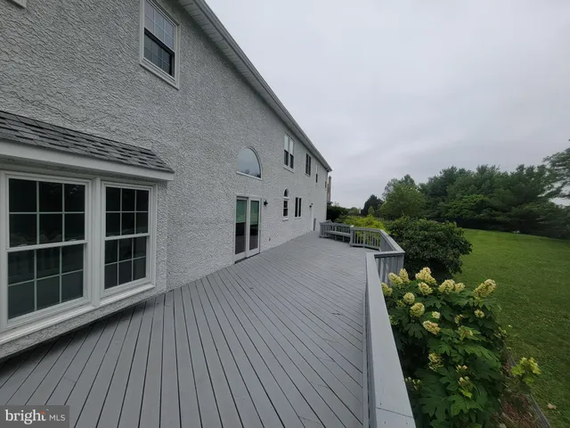 a view of a house with a ocean from a balcony