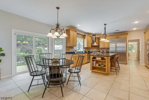 a dining room filled with furniture and window