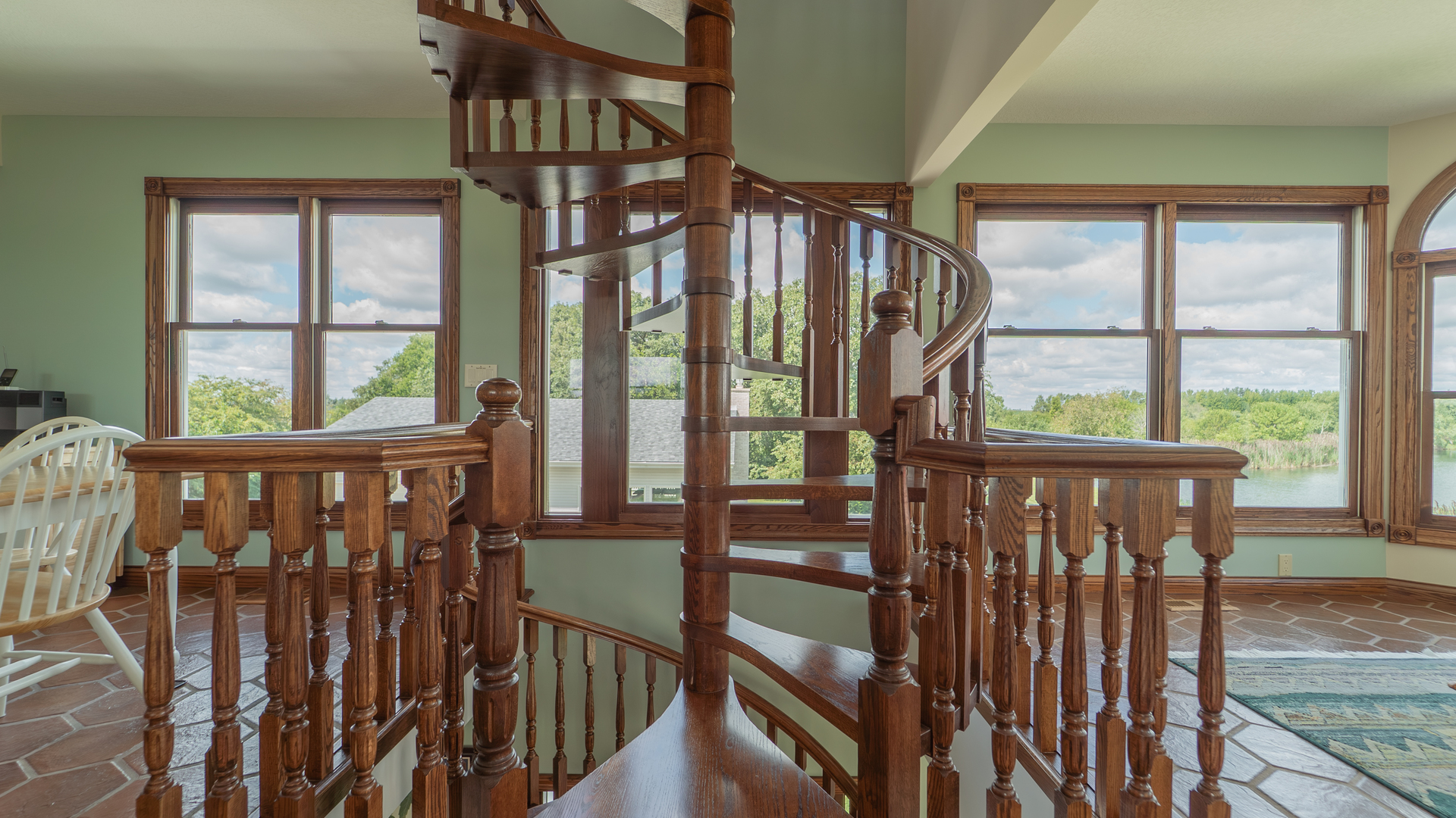 1340 East 2700 North Road Clifton, IL 60927 - Photo 18 of 80 a view of a porch with wooden floor and iron stairs