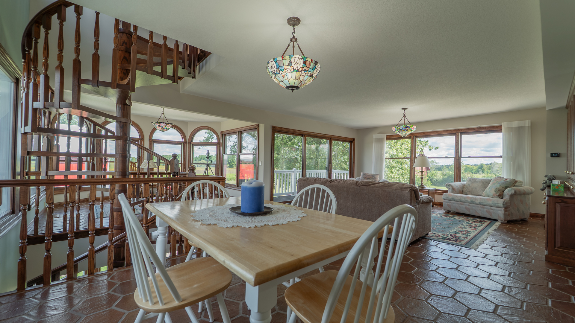 1340 East 2700 North Road Clifton, IL 60927 - Photo 19 of 80 a view of a dining room with furniture a chandelier and wooden floor