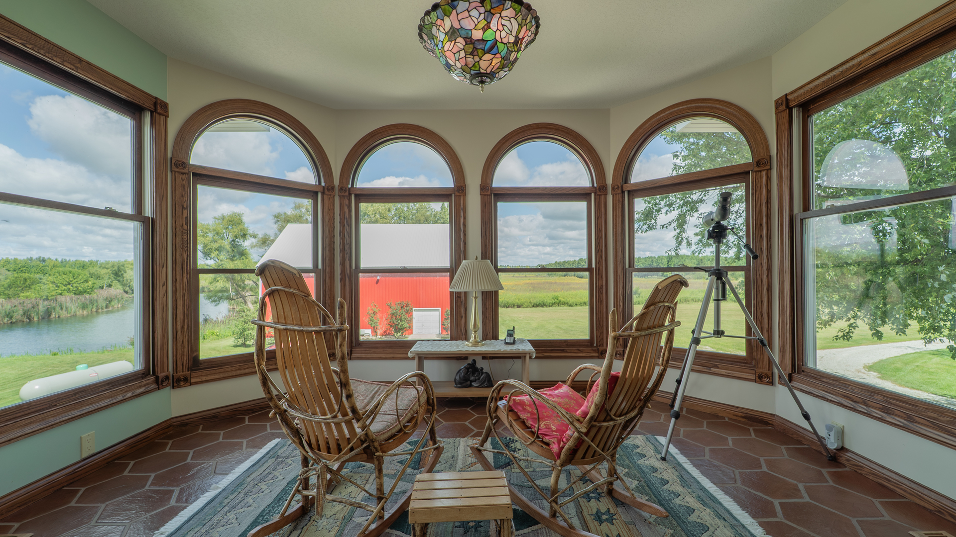 1340 East 2700 North Road Clifton, IL 60927 - Photo 20 of 80 a view of a dining room with furniture large windows and wooden floor