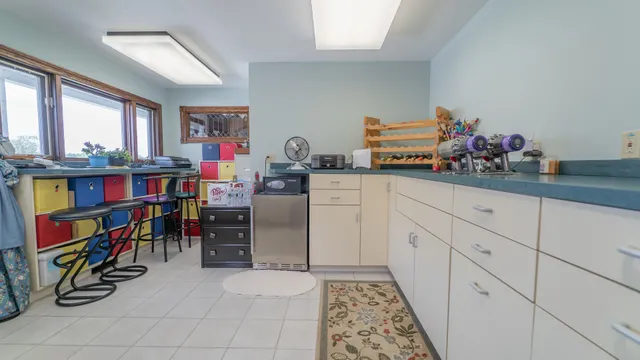 a house view with a play ground in front of it