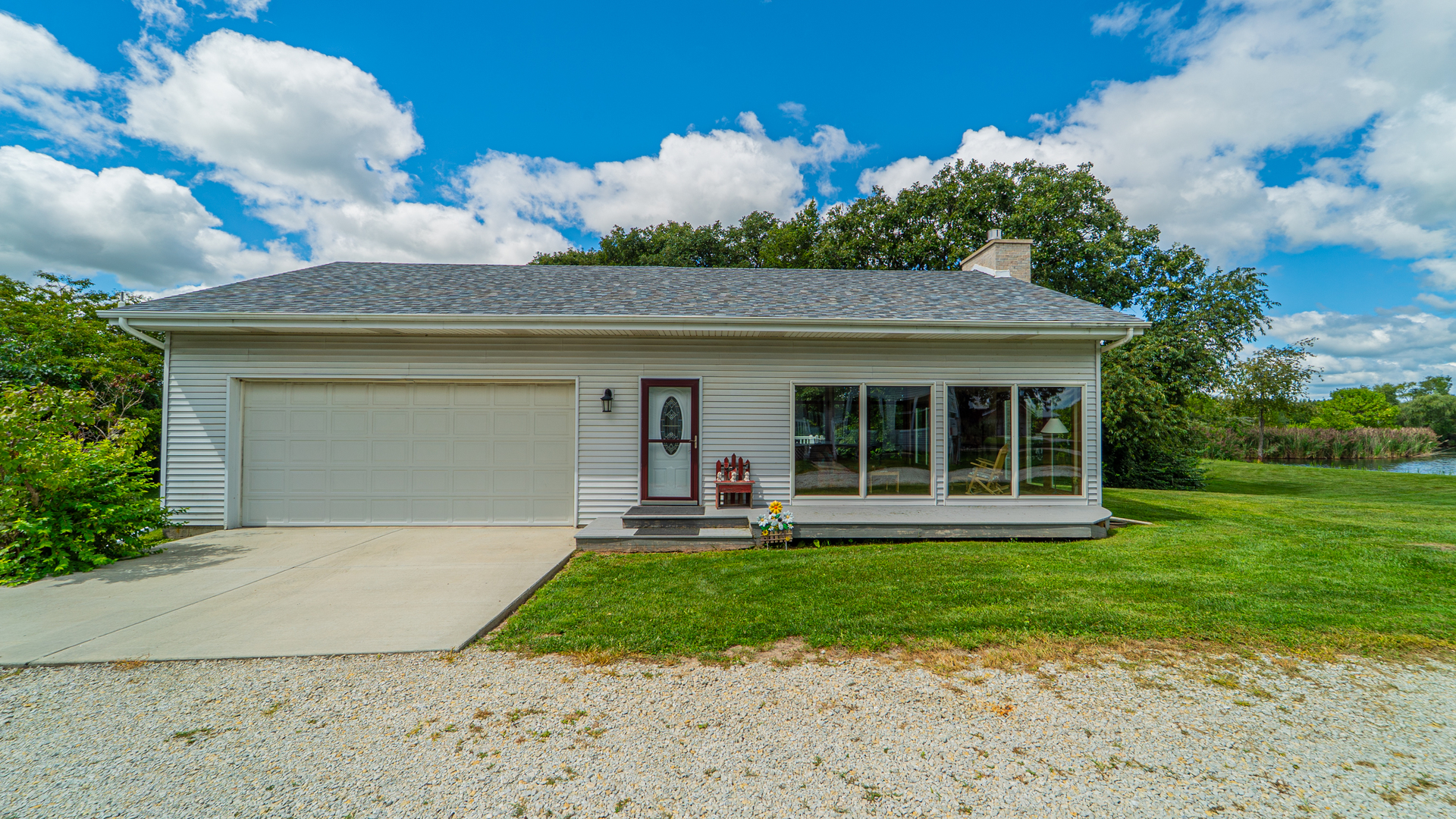 1340 East 2700 North Road Clifton, IL 60927 - Photo 44 of 80 front view of a house with a yard
