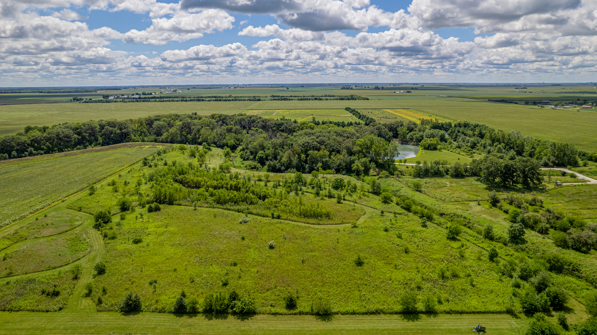 1340 East 2700 North Road Clifton, IL 60927 - Photo 69 of 80 a view of a large body of water with a building in the background
