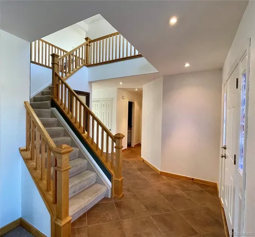 a view of a balcony with furniture