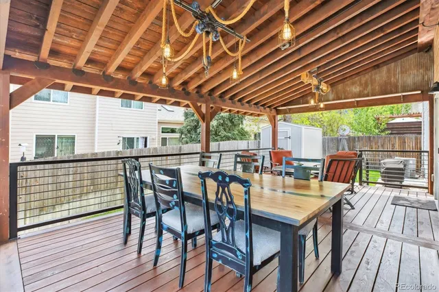 a front view of a house with a garden and plants