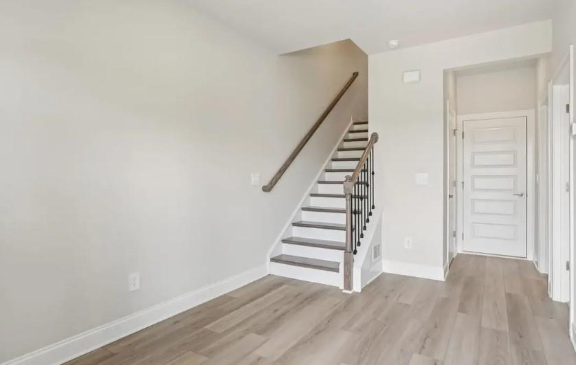 5960 Molo Lane Cumming, GA 30041 - Photo 3 of 17 a view of entryway with wooden floor