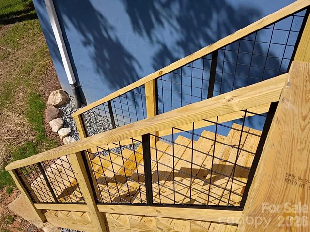 a view of balcony with wooden stairs