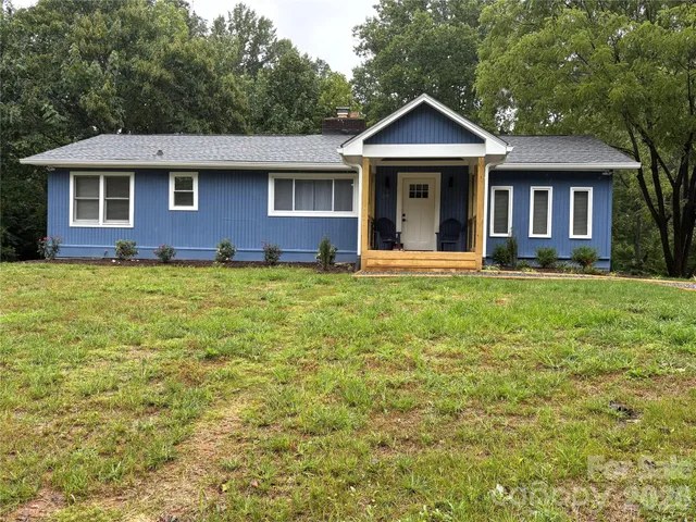 a front view of a house with yard