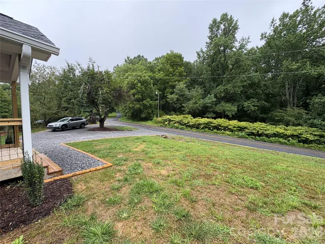 a view of backyard with green space