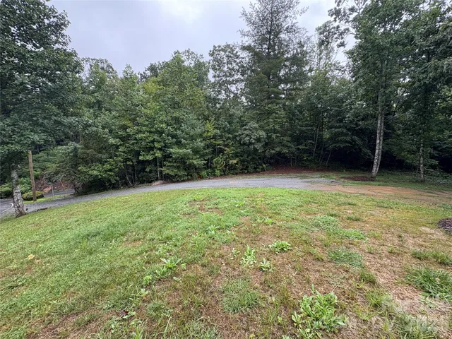 a house with huge green field in front of it