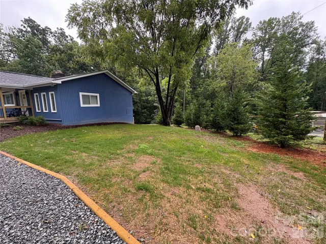 a view of a backyard with green space