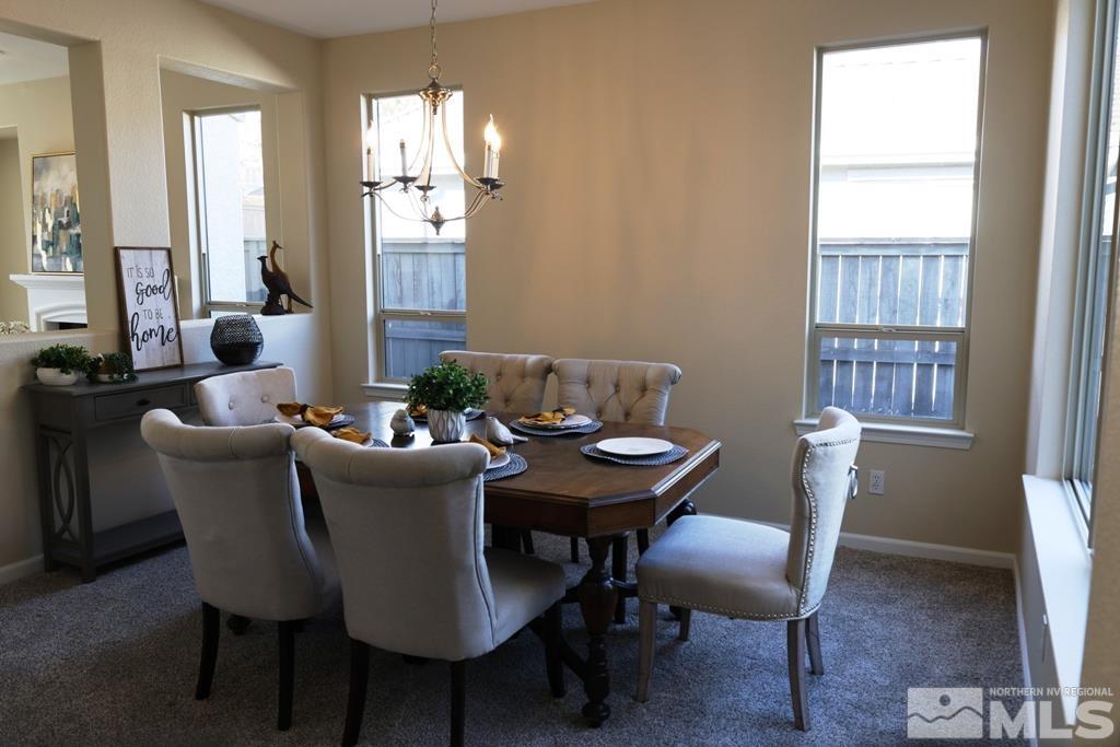 540 Beckfield Court Reno, NV 89521 - Photo 11 of 23 a view of a dining room with furniture window and wooden floor