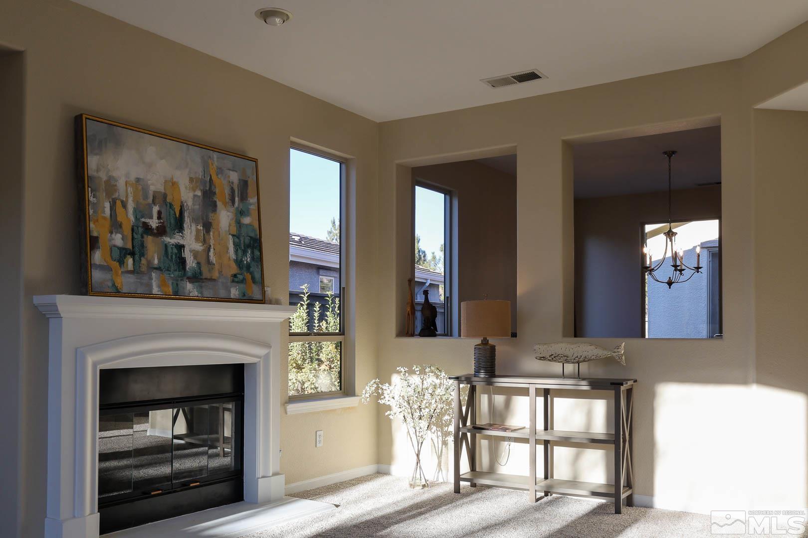540 Beckfield Court Reno, NV 89521 - Photo 12 of 23 a living room with furniture and a fireplace