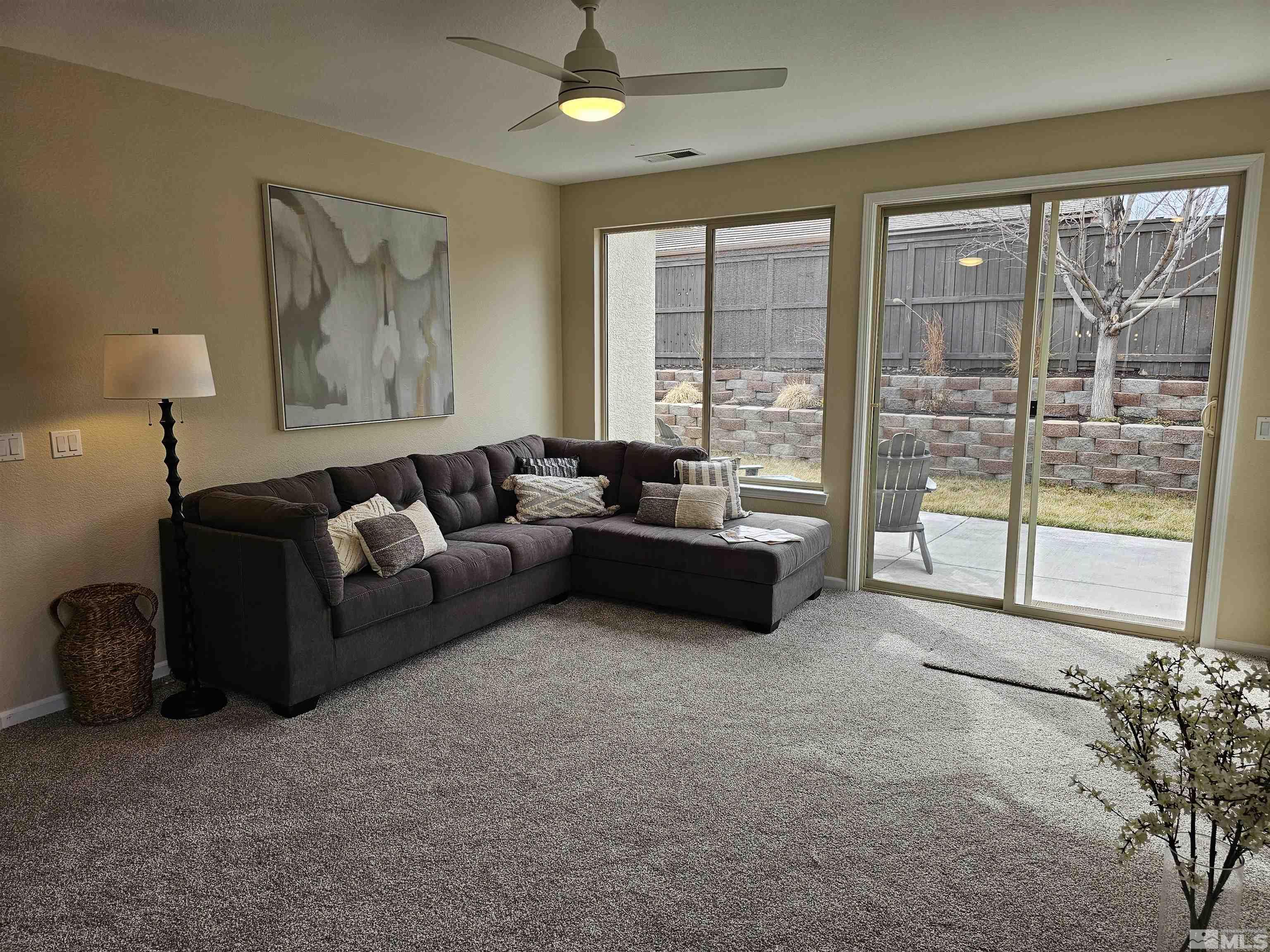 540 Beckfield Court Reno, NV 89521 - Photo 14 of 23 a living room with furniture and a large window