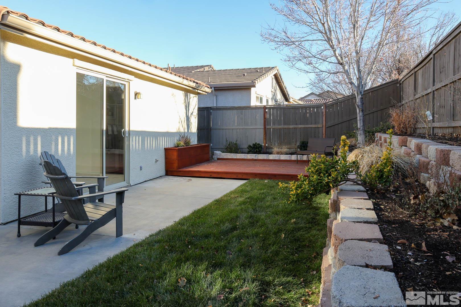 540 Beckfield Court Reno, NV 89521 - Photo 19 of 23 a view of a bench in back yard of a house