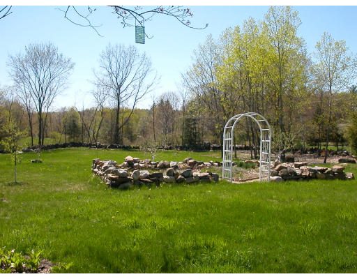 1081 Hill Road Boxborough, MA 01719 - Photo 6 of 8 a swimming pool and trees in the background