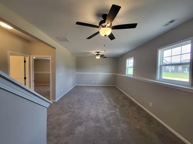 a bathroom with a sink a toilet a shower and a mirror