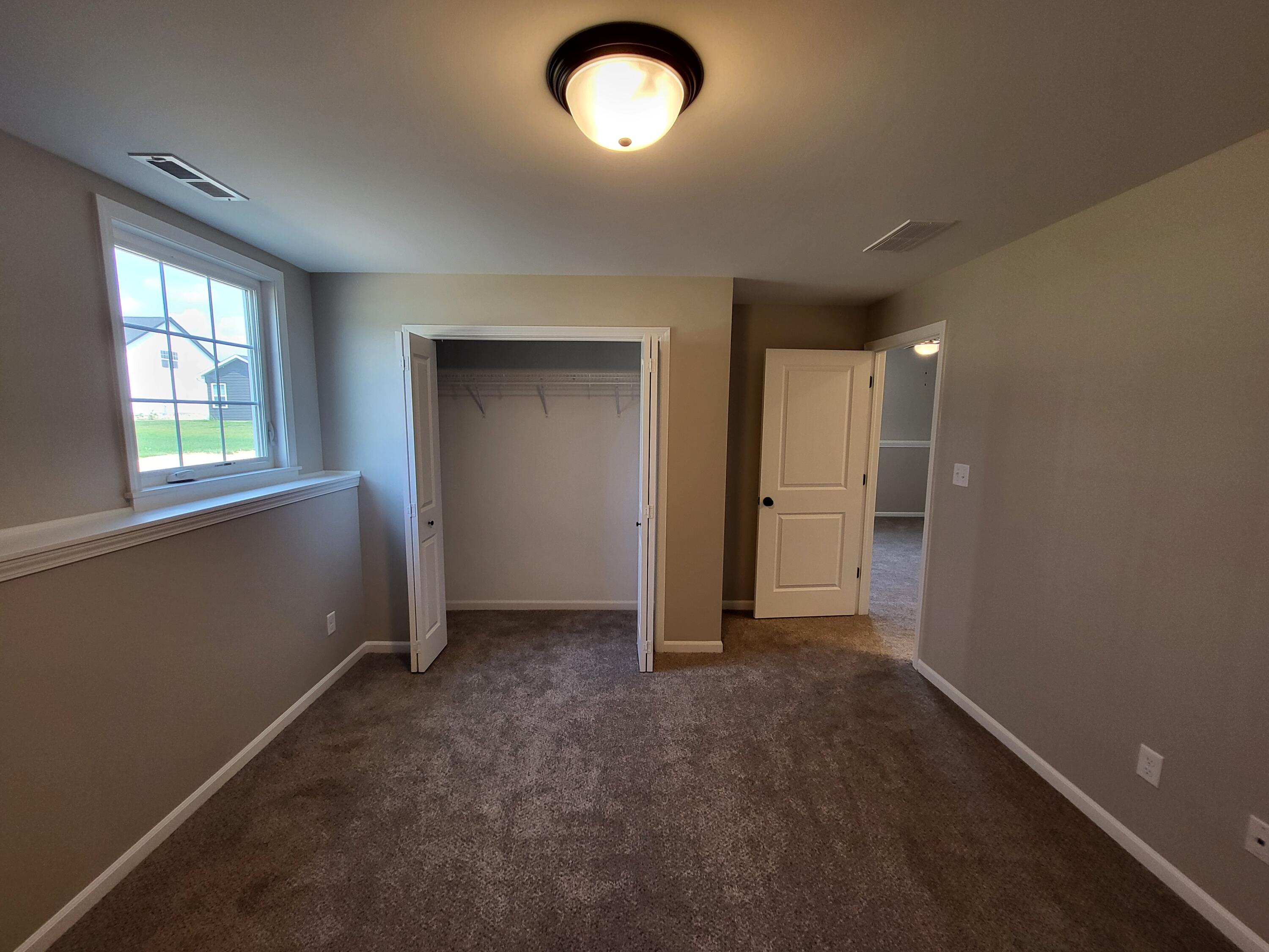 18425 Alexander Avenue Lowell, IN 46356 - Photo 20 of 34 an empty room with window and closet