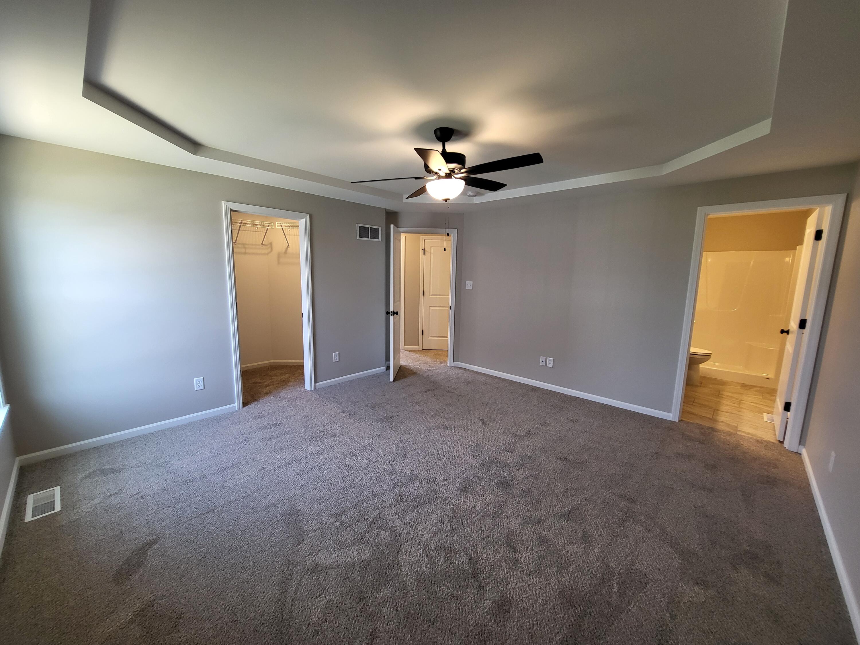 18425 Alexander Avenue Lowell, IN 46356 - Photo 22 of 34 a view of a hallway with a chandelier fan and windows