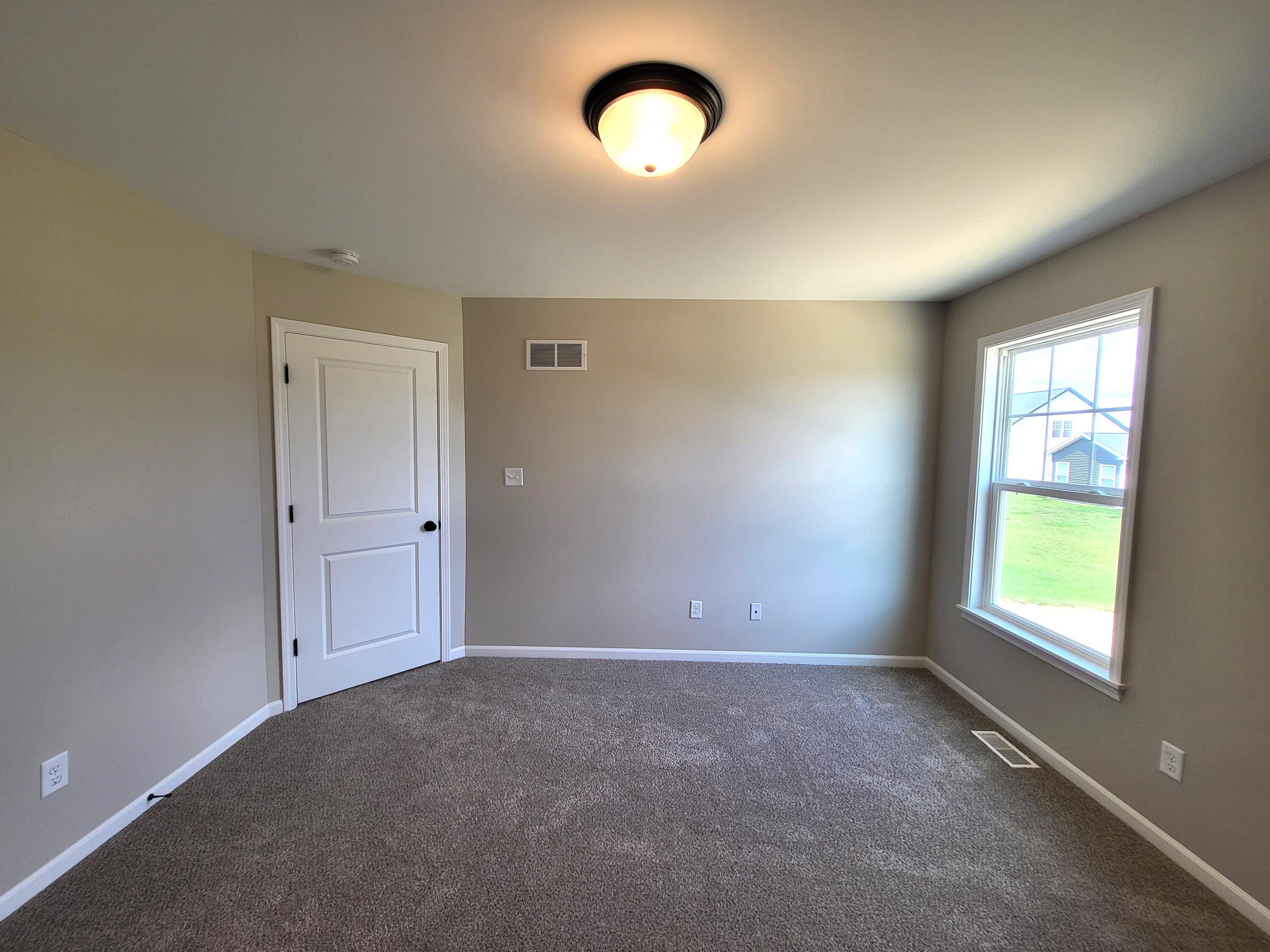 18425 Alexander Avenue Lowell, IN 46356 - Photo 26 of 34 an empty room with a window and doors
