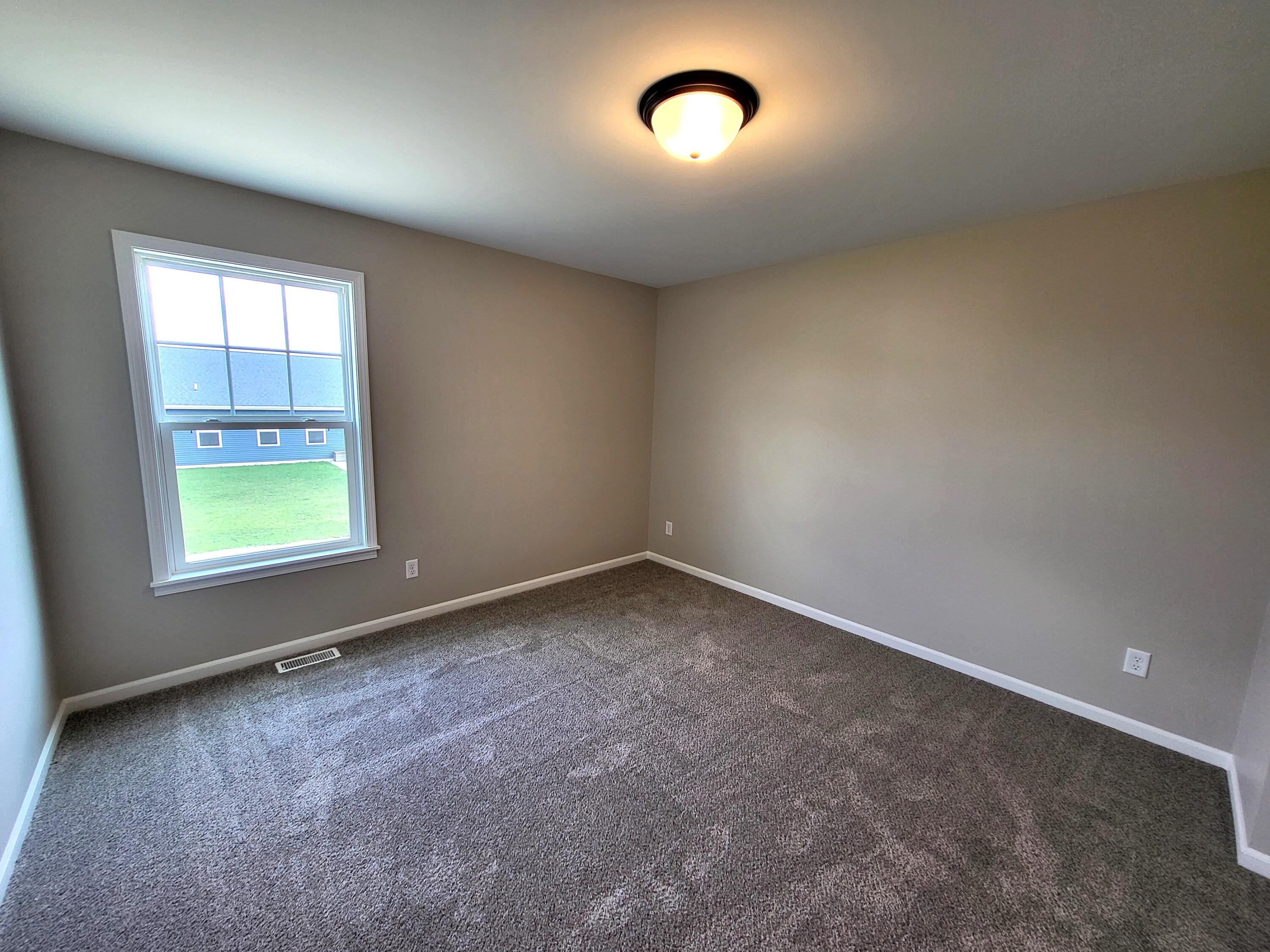 18425 Alexander Avenue Lowell, IN 46356 - Photo 28 of 34 an empty room with a empty space and windows