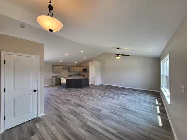 a view of a kitchen with a dishwasher cabinet and a fireplace