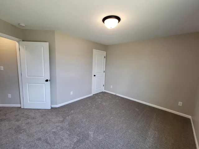 a view of a storage & utility room with closet