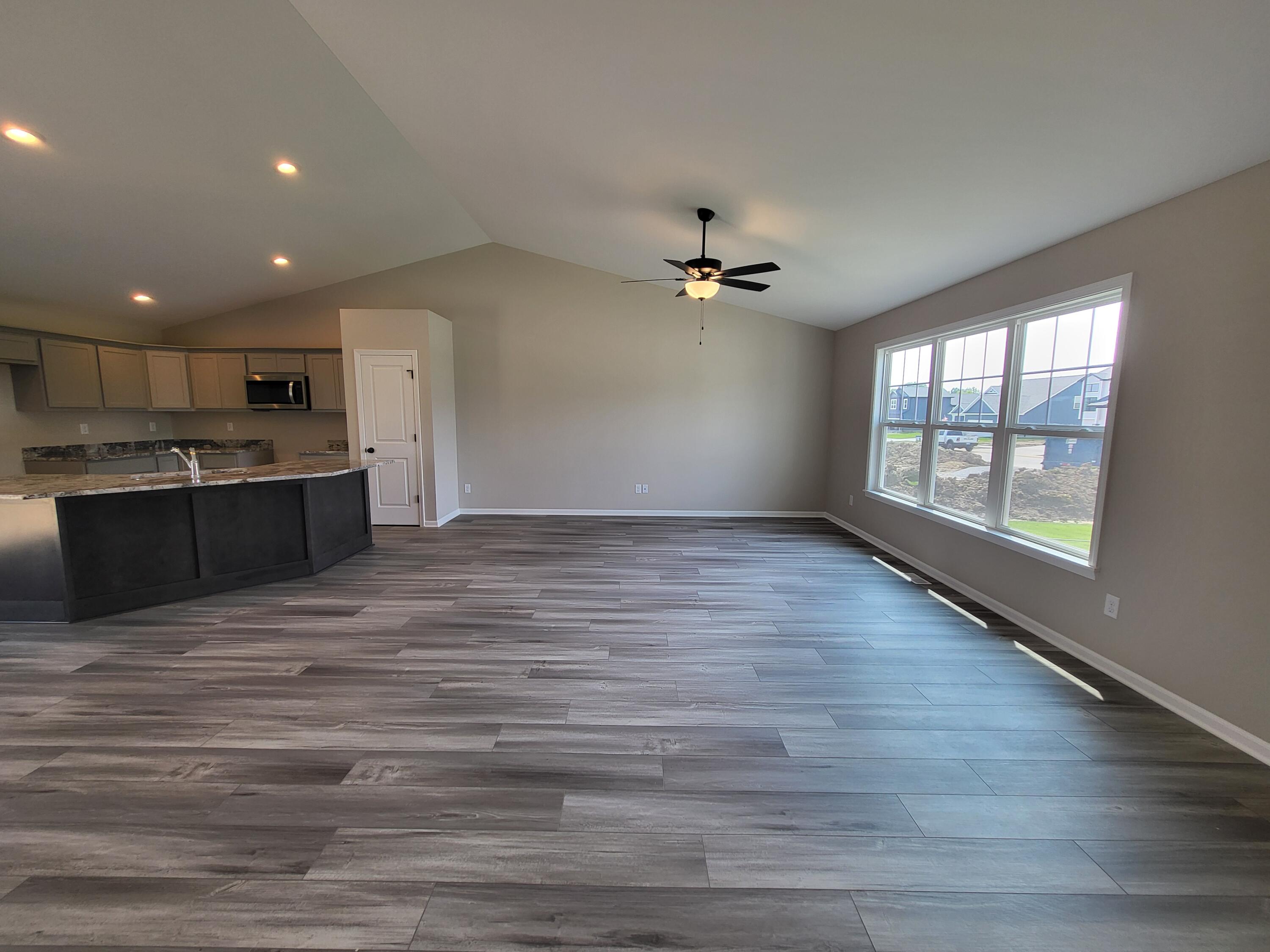18425 Alexander Avenue Lowell, IN 46356 - Photo 8 of 34 an empty room with wooden floor and windows