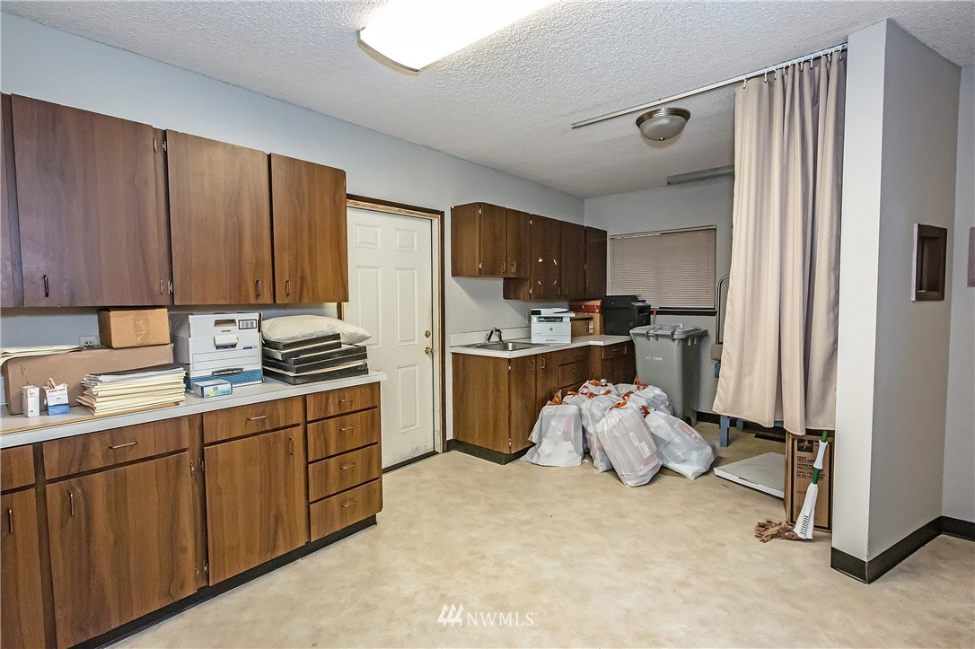 900 Sheridan Road, Unit 105 Bremerton, WA 98310 - Photo 14 of 23 a room with storage and utility