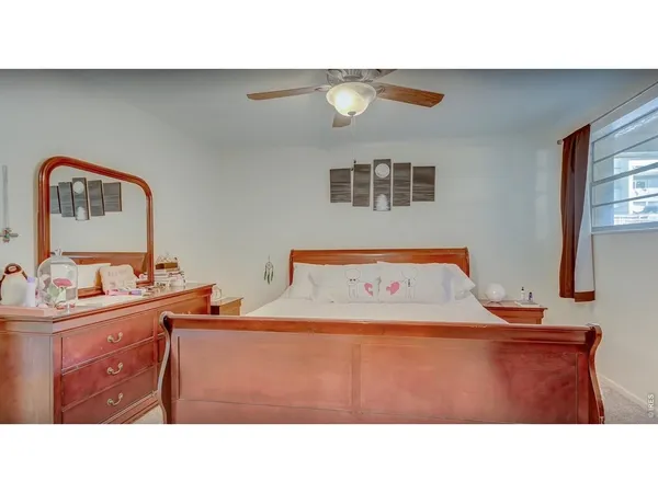 a room with a bed and a mirror