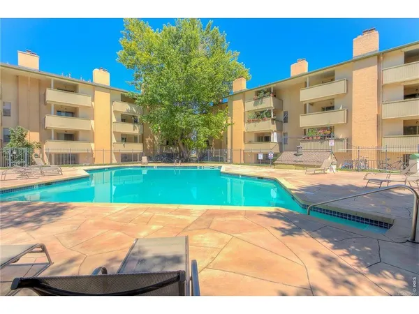 a view of an swimming pool with a yard