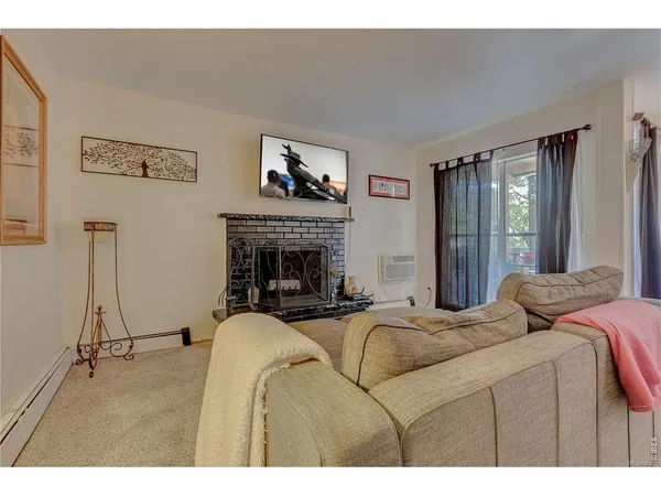 a bedroom with bed and a fireplace