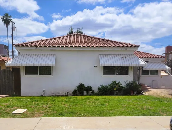 a view of a house with a garden