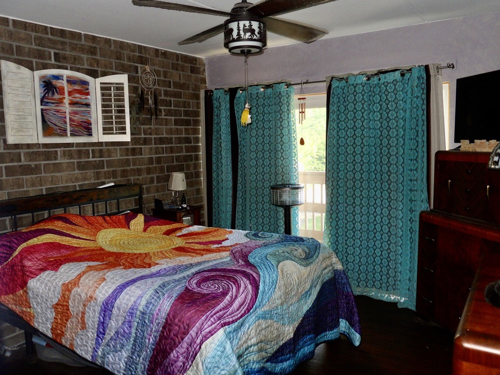 108 Kenneth Circle Elgin, IL 60120 - Photo 15 of 28 a bedroom with a bed and a television